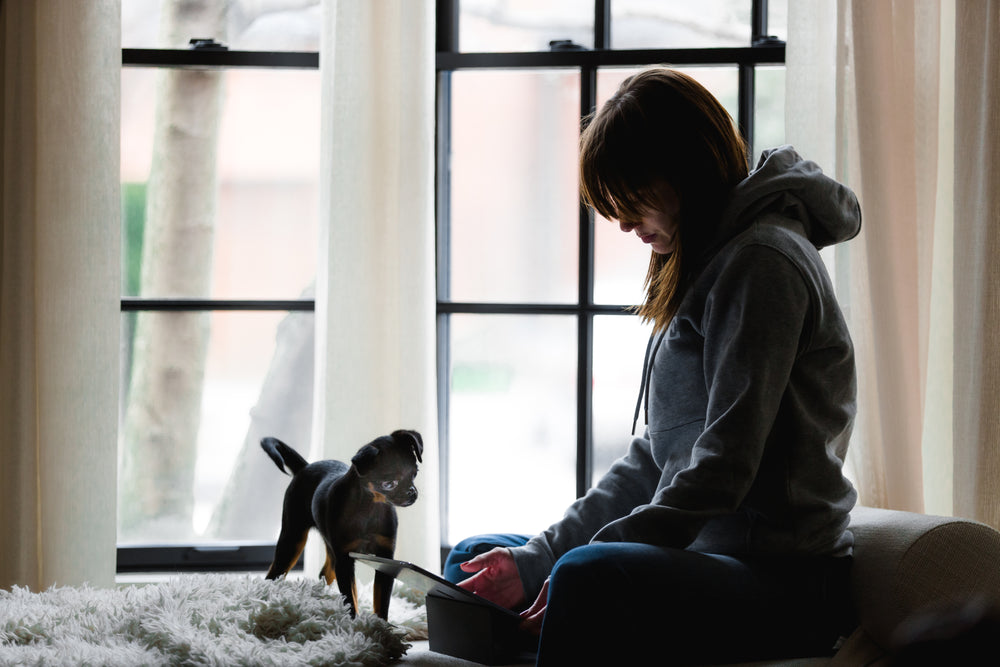 A happy pet mum with her cute pup